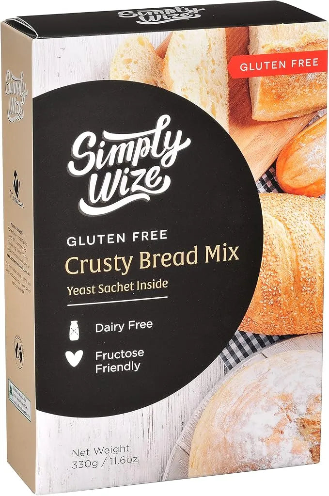 Simply Wize gluten free crusty bread mix packaging with images of bread on a wooden surface.